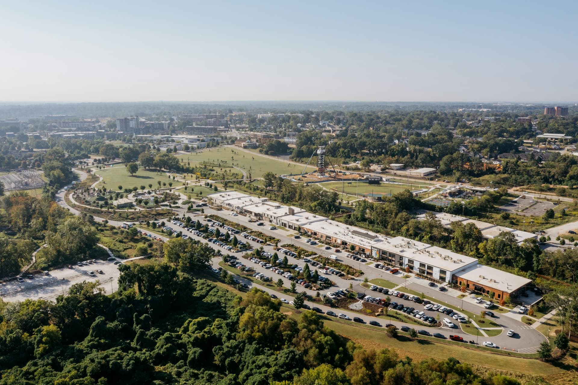 Aerial view of a suburban commercial complex with buildings and parking lots