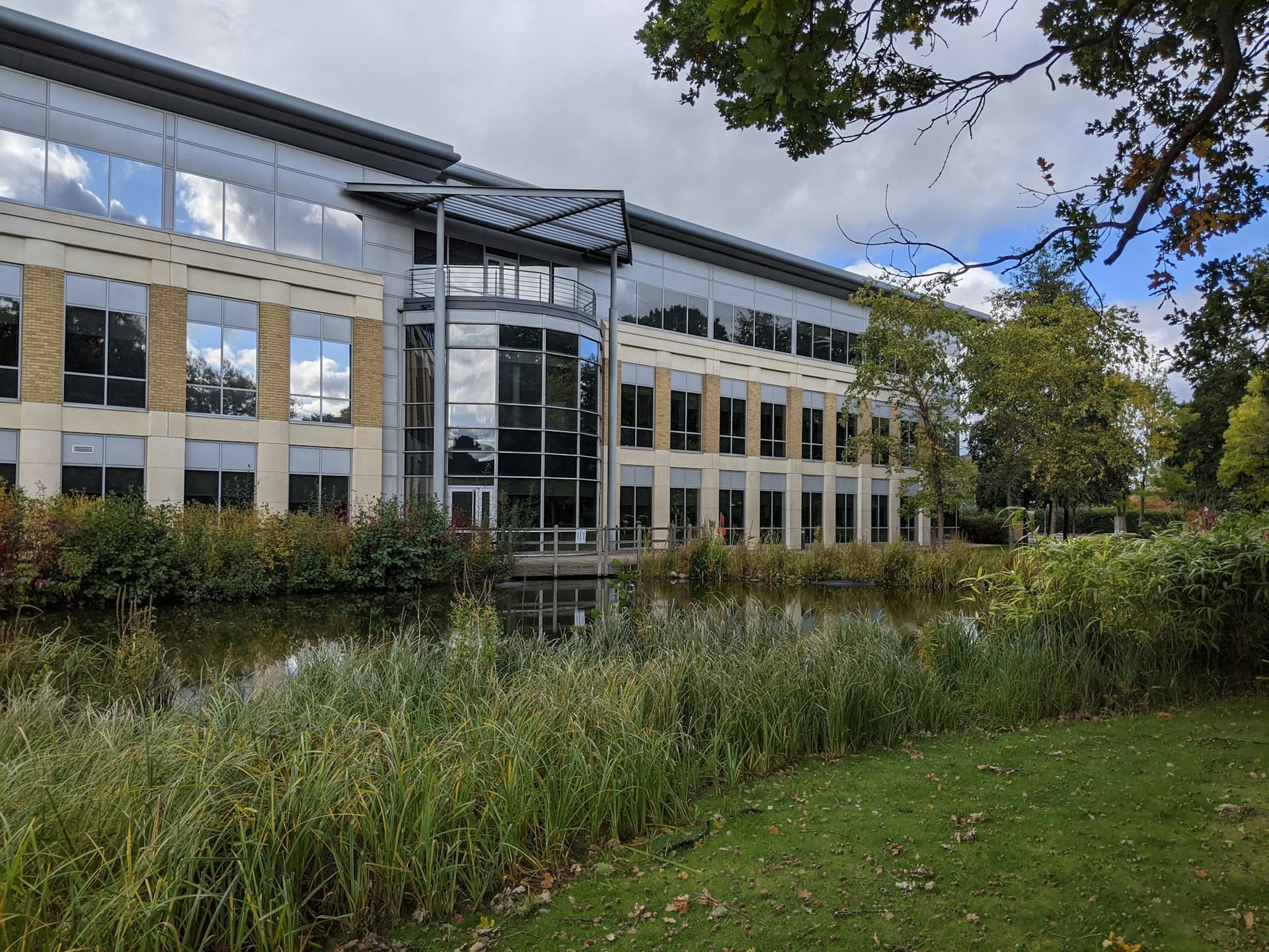Suburban office building beside a landscaped lawn