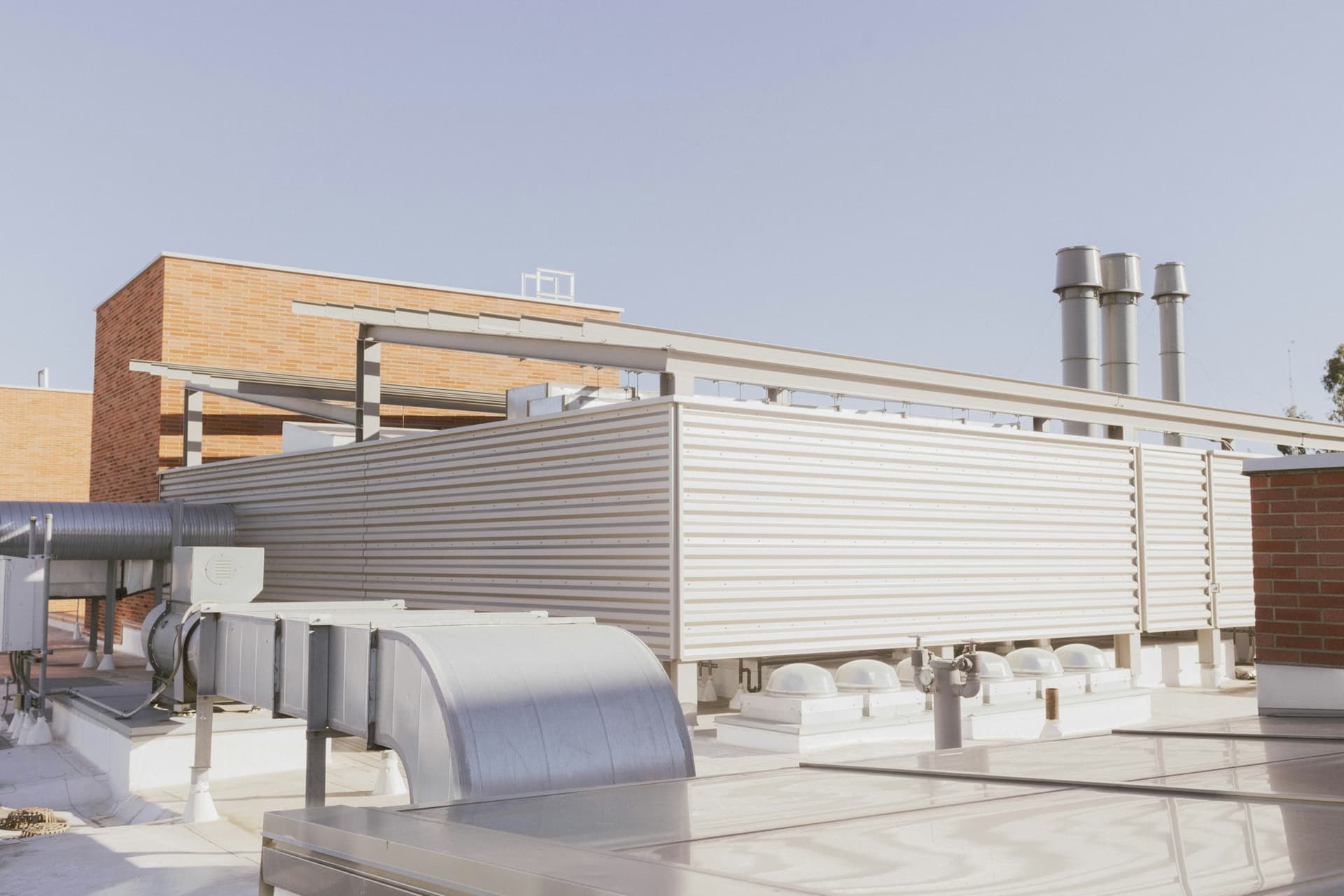 Rooftop mechanical equipment and ductwork on a commercial building