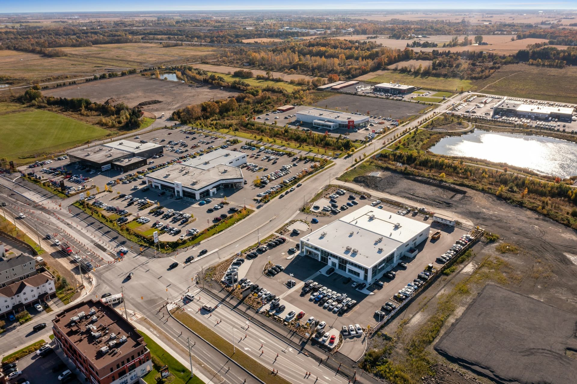 Aerial view of a large commercial building and its parking lot