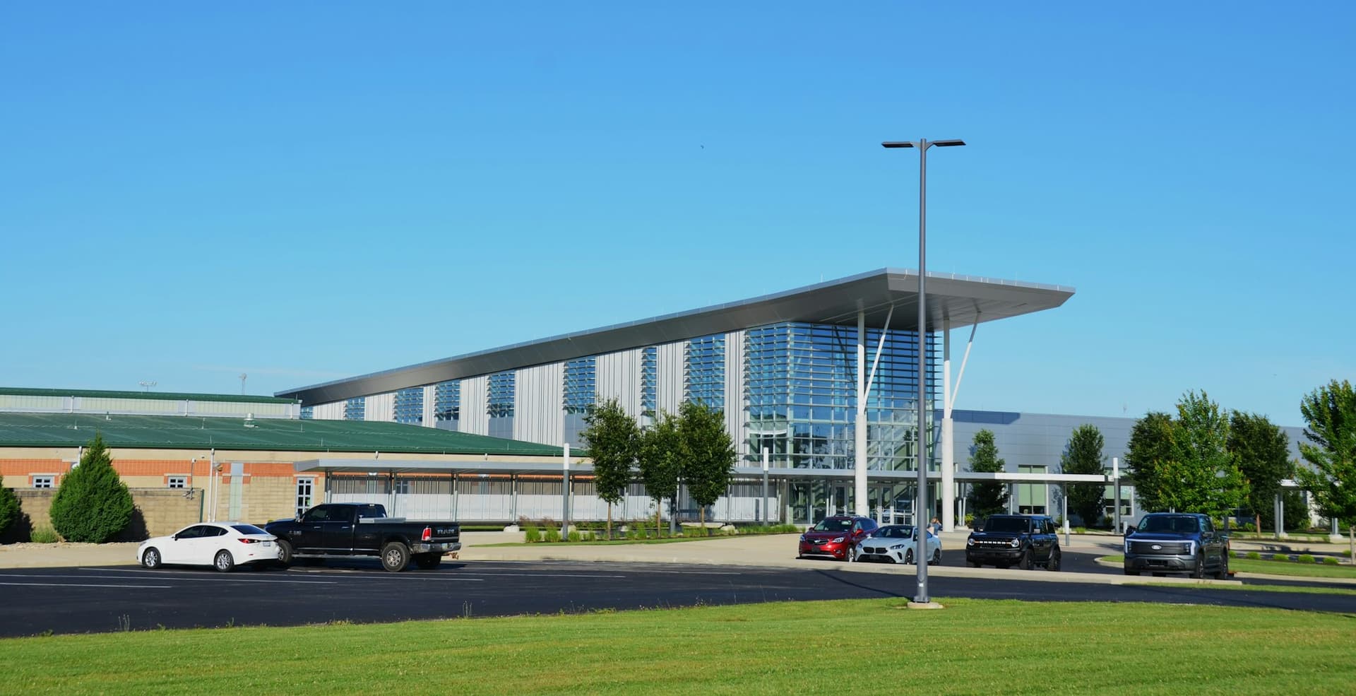 Contemporary commercial building with a canopy entrance and parking lot